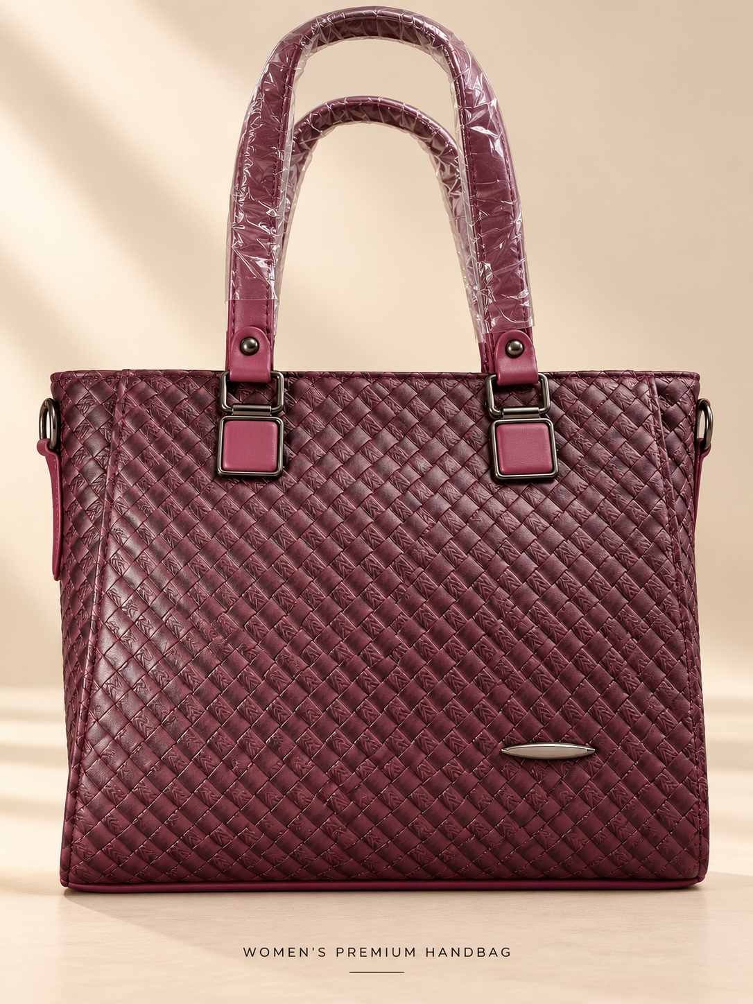 Women's burgundy woven-texture handbag with glossy finish, two top handles and square gunmetal fittings