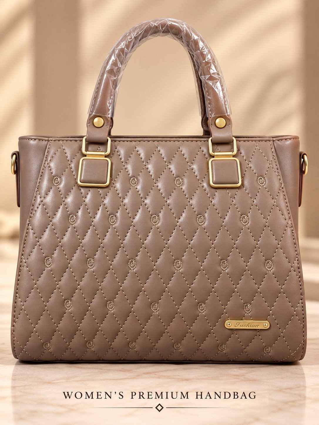 Women's taupe diamond-quilted handbag with embroidered floral motifs, gold-tone plaque and buckle top handles