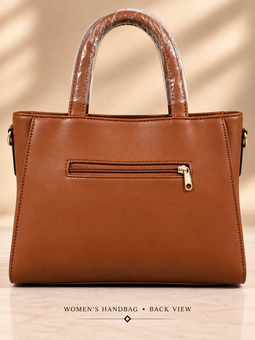 Women's brown ribbed handbag with two rounded top handles, gold-tone hardware and an oval front logo plate — image 3