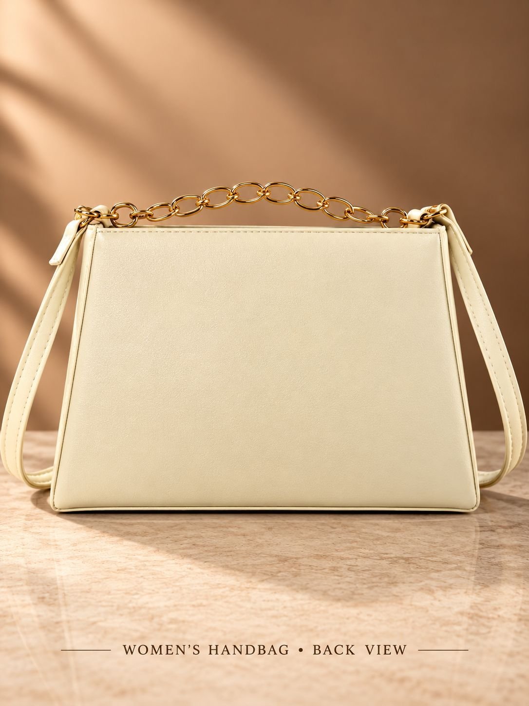 Women's champagne gold glitter party handbag with gold-tone chain handle, cream shoulder strap and trapezoid shape — image 2