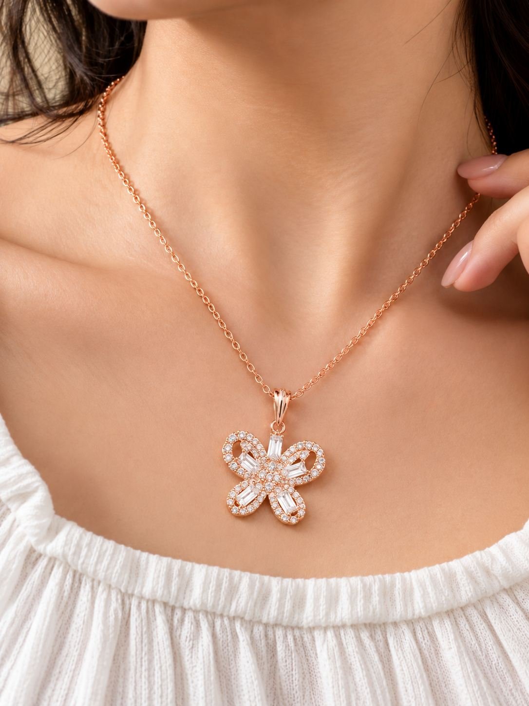 Rose gold-tone butterfly pendant necklace for women with clear stones and baguette crystals on a fine chain, worn on the neck — image 3